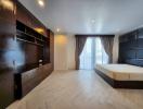 Spacious bedroom with modern furnishings and ample natural light