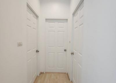 Bright and clean hallway with multiple doors