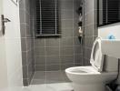 Modern bathroom with tiled flooring and walls