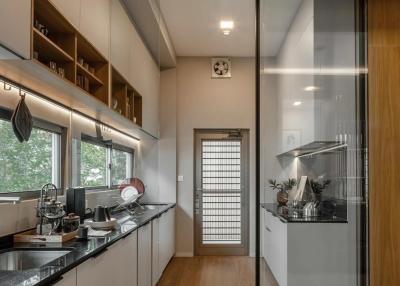 Modern kitchen with stainless steel appliances and wooden cabinets