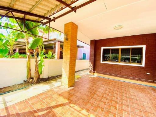 Spacious brick patio with covered area and natural lighting