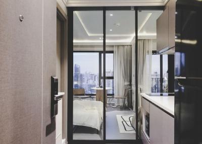 Modern bedroom with city view and glass partition