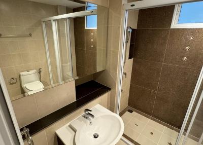 Modern bathroom with shower cubicle and sink