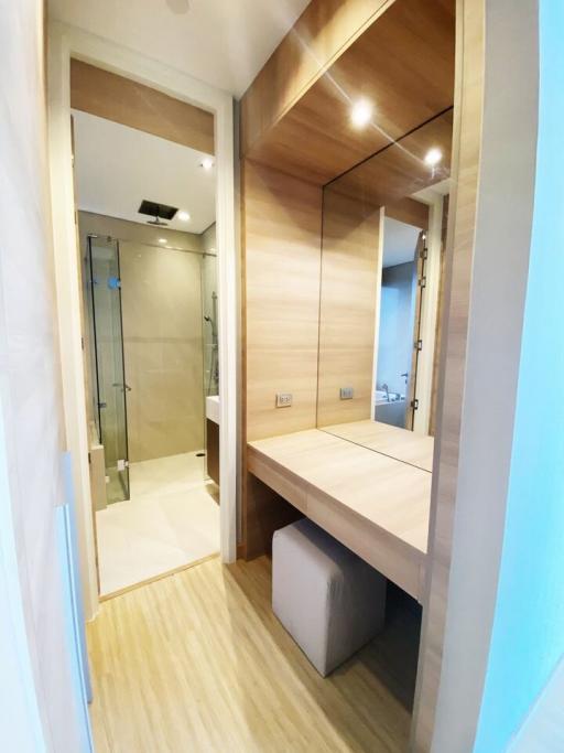Modern bathroom with a large mirror and glass shower