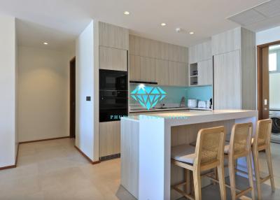 Modern kitchen with built-in appliances and breakfast bar