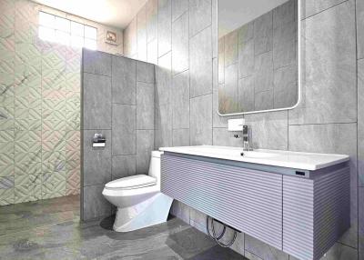 Modern bathroom interior with a floating vanity, toilet, and tiled walls