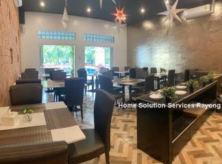 Spacious restaurant interior with modern dining tables and chairs