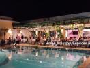 Poolside Party Area with Guests and Festive Lighting