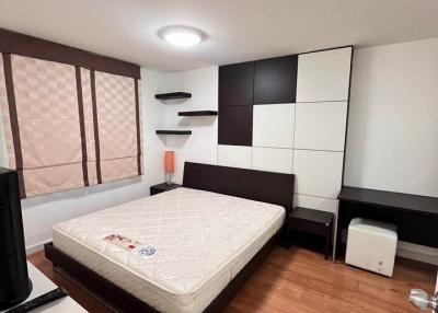 Modern bedroom with large bed and built-in wardrobes