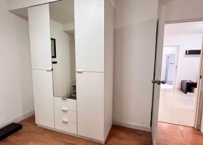 Modern bedroom interior with a large wardrobe