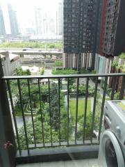 Balcony view of urban surroundings with a washing machine