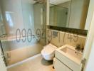 Modern bathroom with glass shower stall and vanity