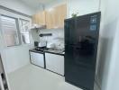 Modern and compact kitchen with stainless steel appliances
