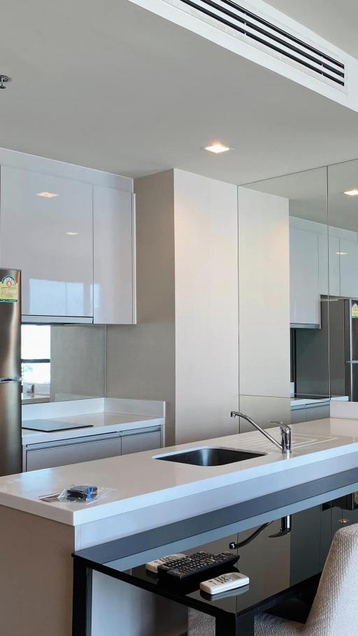 Modern kitchen with white cabinetry and stainless steel appliances