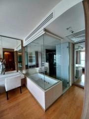 Modern spacious bathroom with a large bathtub and glass shower enclosure