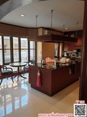 Spacious kitchen with modern appliances and breakfast area