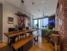 Spacious dining area with modern brick wall design and large windows