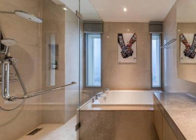 Modern bathroom with dual showers and art
