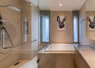 Modern bathroom with dual showers and art