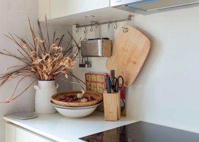 Modern kitchen corner with utensils and decorative items