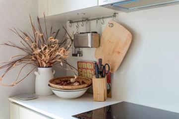 Modern kitchen corner with utensils and decorative items