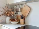 Modern kitchen corner with utensils and decorative items