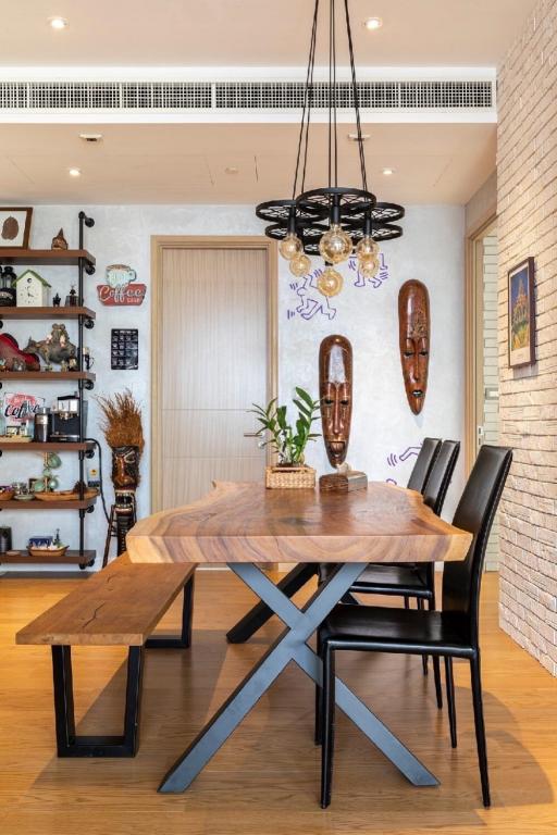 Modern dining area with a wooden table and chic decor