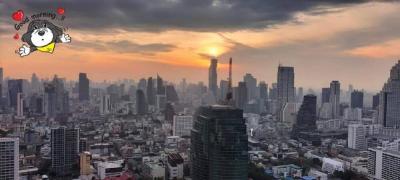 Sunrise over a bustling cityscape with skyscrapers