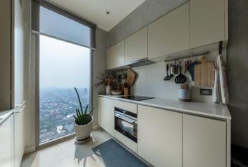 Modern kitchen with large window overlooking the city