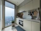 Modern kitchen with large window overlooking the city