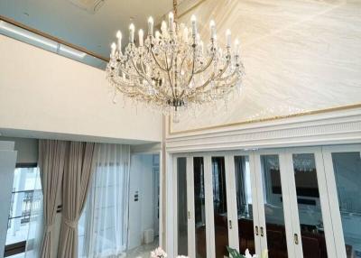Elegant dining room with luxurious chandelier and marble flooring