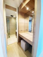 Modern bathroom with glass shower and wooden vanity