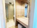 Modern bathroom with glass shower and wooden vanity