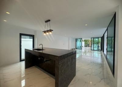 Modern kitchen with large island and ample natural light