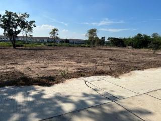 Empty residential lot ready for construction with clear skies