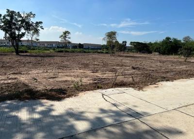 Empty residential lot ready for construction with clear skies