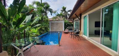 Private pool and patio area with tropical garden