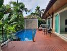 Private pool and patio area with tropical garden