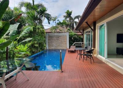 Private pool and patio area with tropical garden
