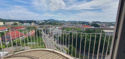 Panoramic city view from a high-rise apartment balcony