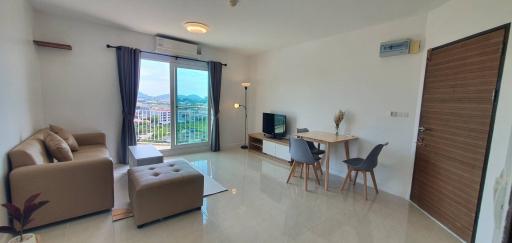 Spacious living room with natural light and scenic view