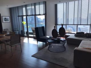 Modern living room with large windows and city view