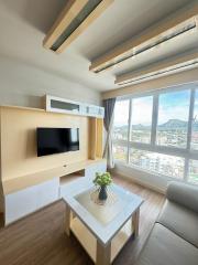 Cozy living room interior with modern furniture and city view