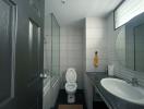 Modern bathroom with tiled walls and natural light