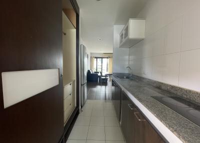 Modern kitchen with a view into the living area