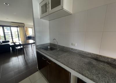 Modern kitchen with granite countertops and stainless steel sink