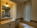 Spacious bathroom with natural light and double vanity