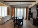 Spacious living room with dining area and built-in shelving