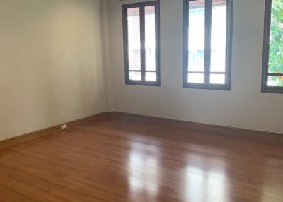Empty bedroom with hardwood floors and ceiling fan