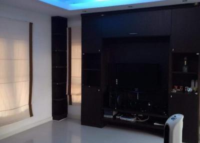 Modern living room with ambient lighting and entertainment unit